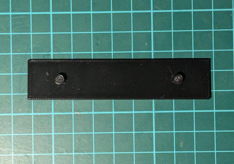 Ethernet Switch Wall Mount Bracket [DLink DES-105; 58mm Pitch, 3mm Studs]