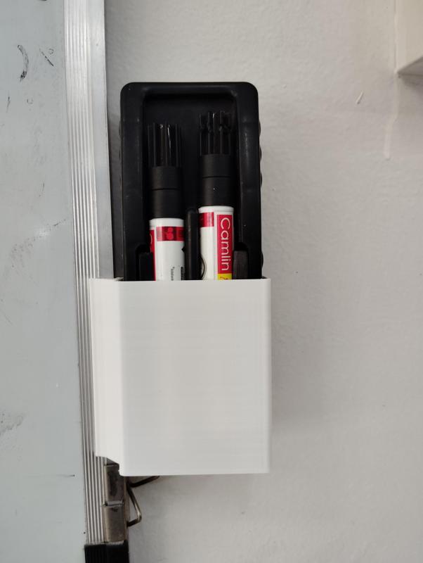 Duster holder Attached to white Board.