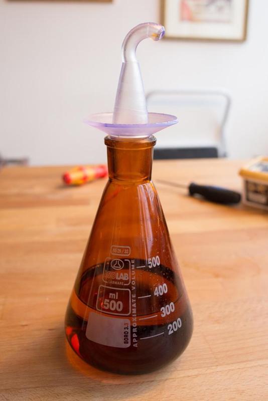 Bottle pourer for cooking oil fits on a standard ground-joint bottle