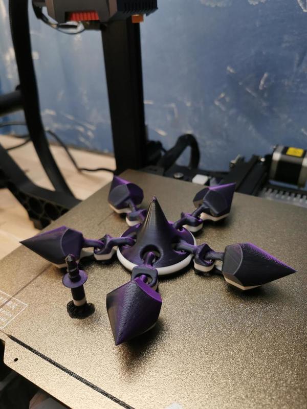 Articulated spinning top