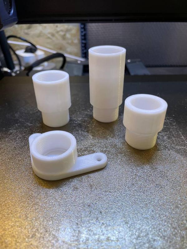 Threaded positioners and raisers for ACMER P2 laser engraver machine.