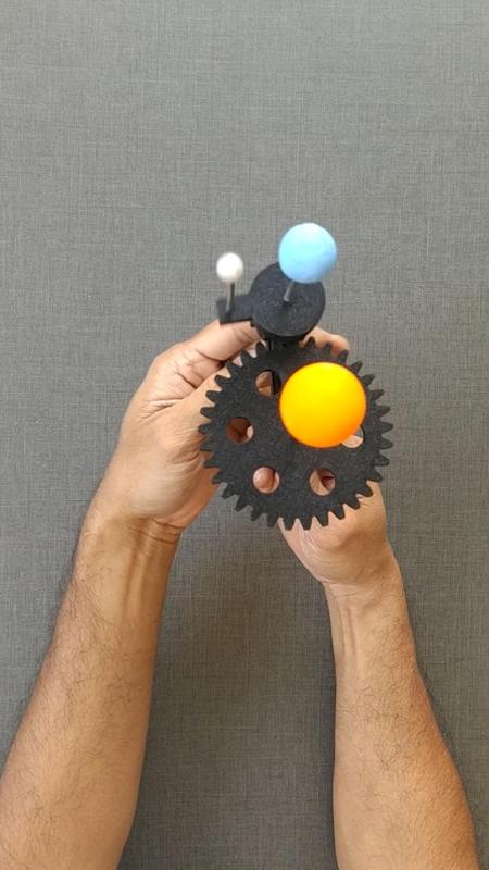 Handheld model of Sun Earth and Moon