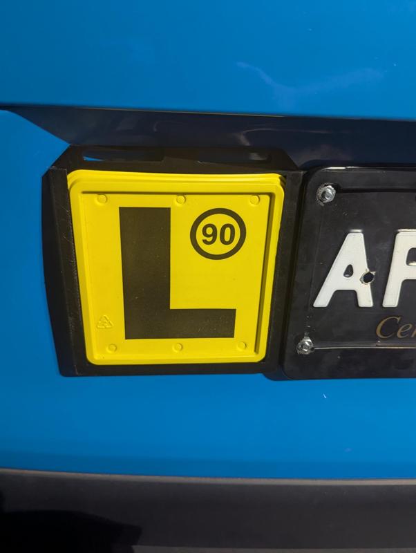 Australian Learner’s Plate Mounting Bracket that attaches to car license plate.