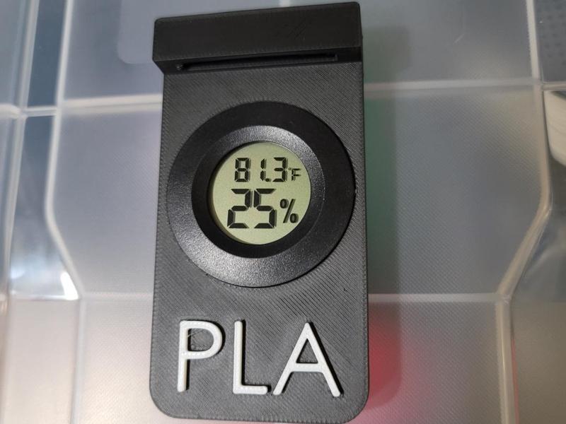 Moisture meter holder for waterproof container