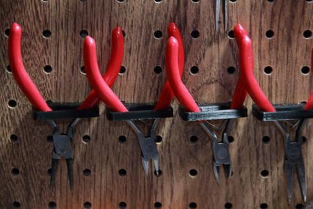 peg board pliers holder