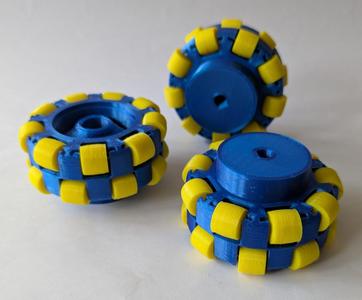 Push fit omni-wheel for a geared drive motor