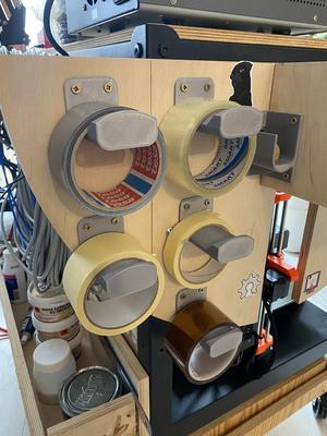 Wall-mounted tape holder