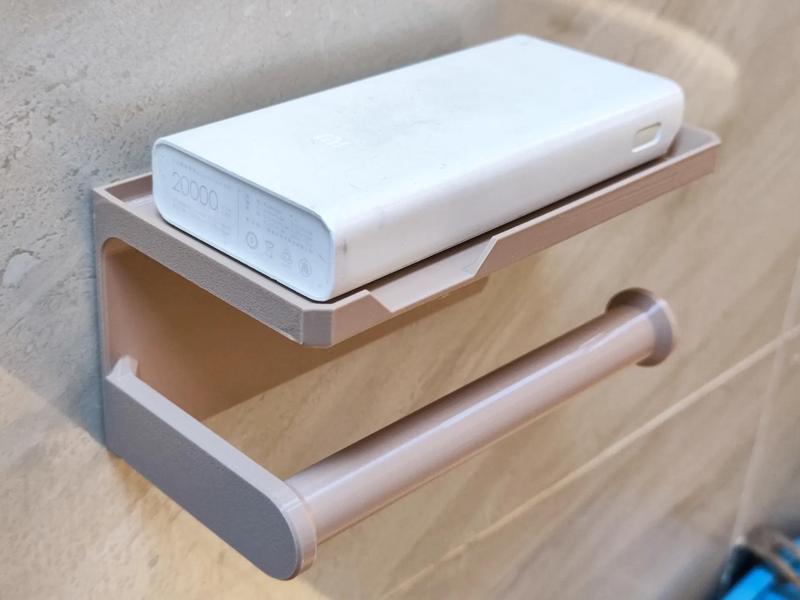 Toilet paper holder with a phone stand