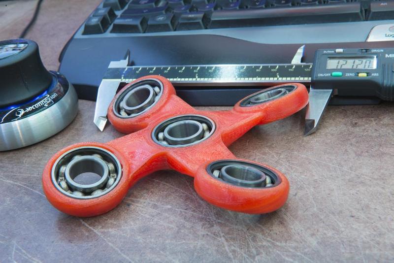 Large quad offset angled fidget spinner. 