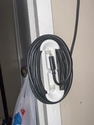 Wall mounted cable holder
