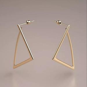 gold triangle earrings model
