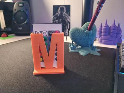 Letter M led remote holder