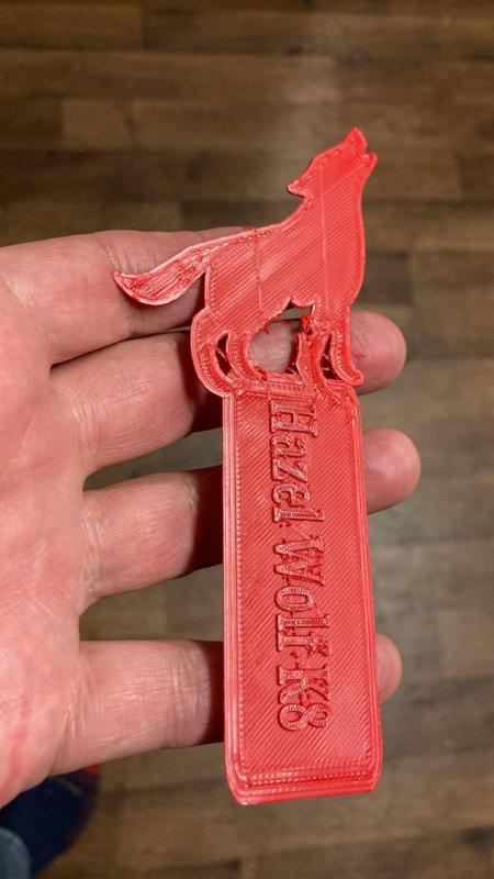 A bookmark for my school with the logo up top and the name on the blade (is that what it's called?)