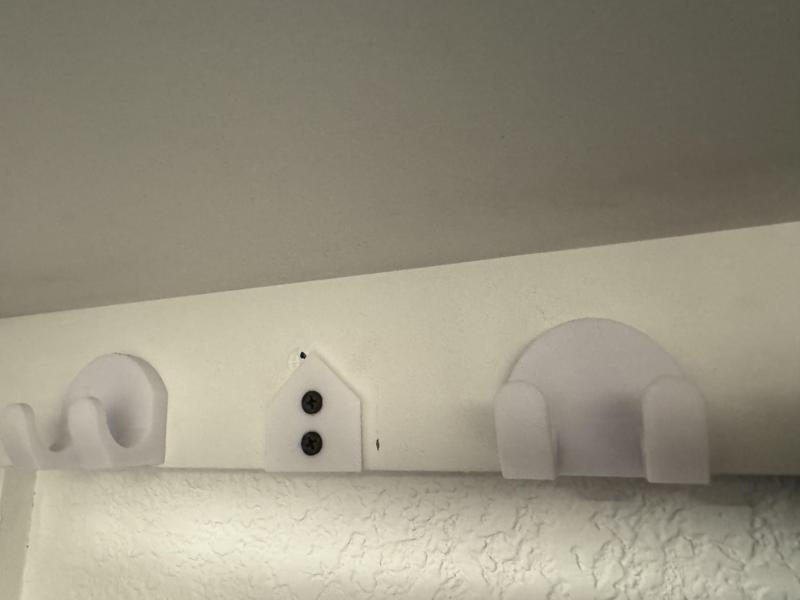 Clothes hook with hidden fasteners