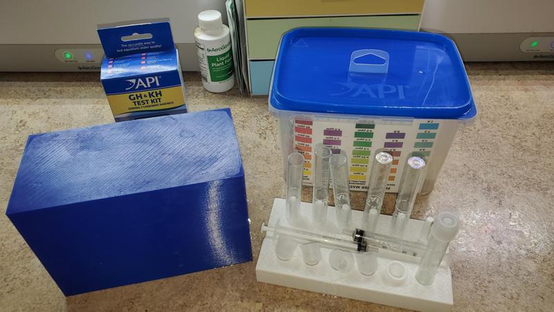 Aquarium test stand with drying rack and cover.