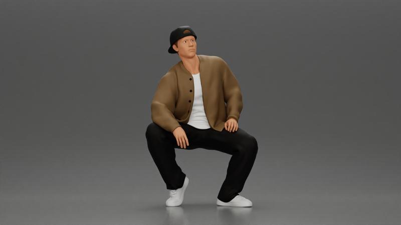 hip hop man sitting in a jacket and cap