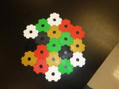 Interlocking hexagons with holes for modular DIY board game