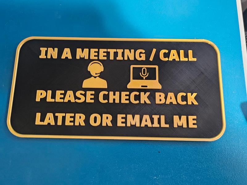 In A Meeting Door Sign