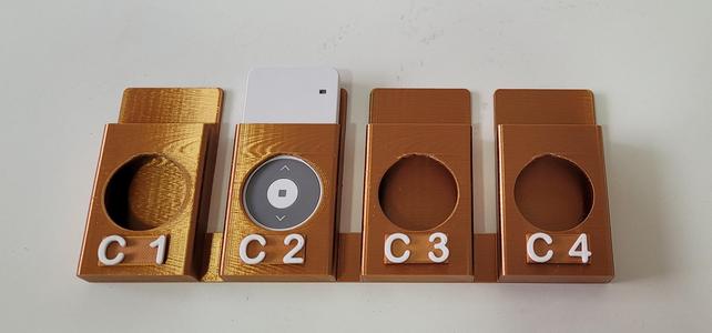Wall bracket for four remote controls