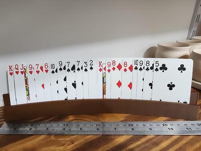 Playing cards holder with slanted slot