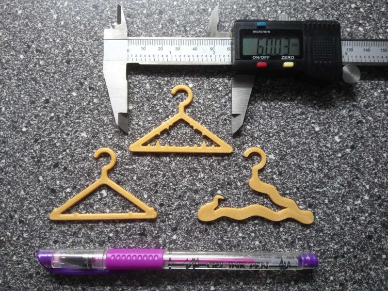 THREE HANGERS FOR DOLL CLOTHES - BARBIE