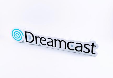 Sega Dreamcast display piece and magnet sign.
