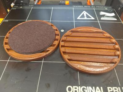 Coaster with Felt pad and drain.