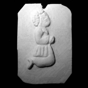 Medal depicting a kneeling child at The British Museum, London