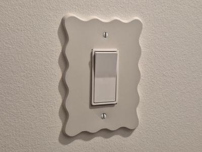 Wavy light switch plate
