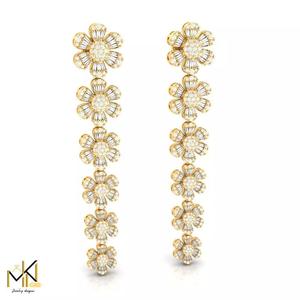 Long earrings adorned with flowers and baguette diamonds