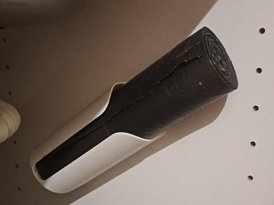 Wall mount for garbage bag roll