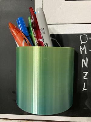 Pen holder for magnetic board