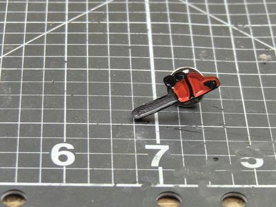 Chainsaw enamel pin