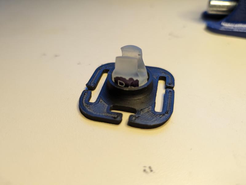 Magnetic hydration hose retaining clip