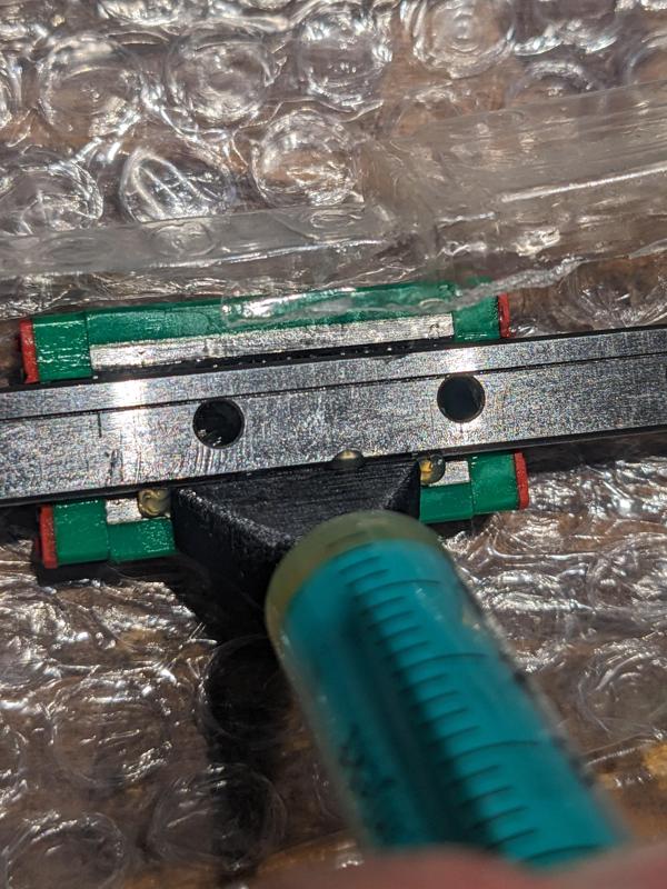 Linear rail greasing tool