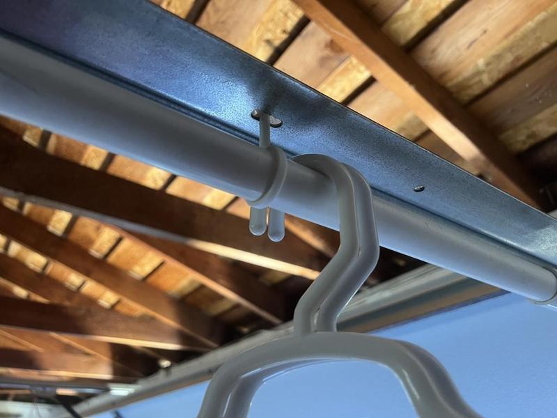 garage door clothes rod hangar