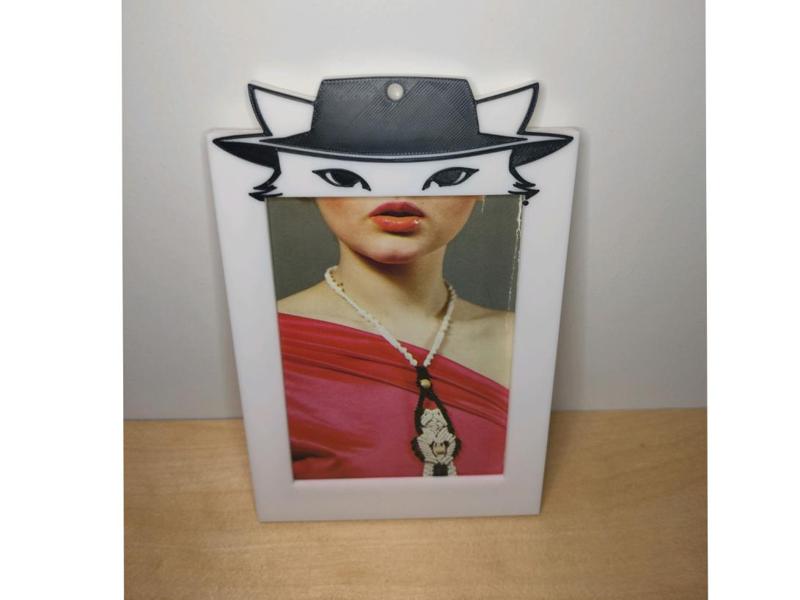 Photo frame with cat eyes, holding up to 8 photos