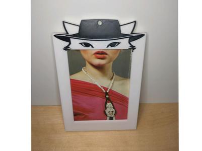Photo frame with cat eyes, holding up to 8 photos