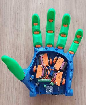 Voice activated low cost motorized hand