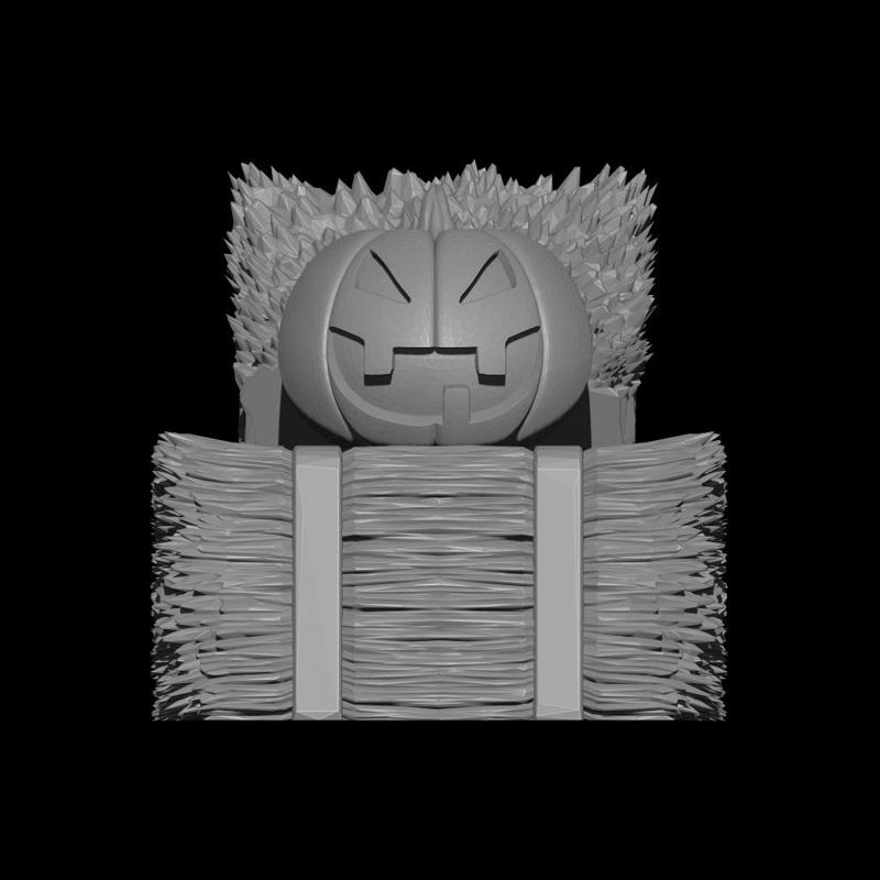 Halloween Jack-o'-lantern on bale of hay