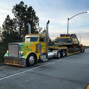 Peterbilt 350 with Excavators on road