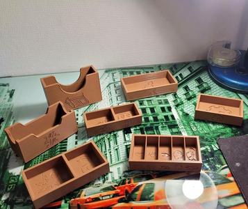 Arkham Horror Third Edition and Under Dark Waves boxes