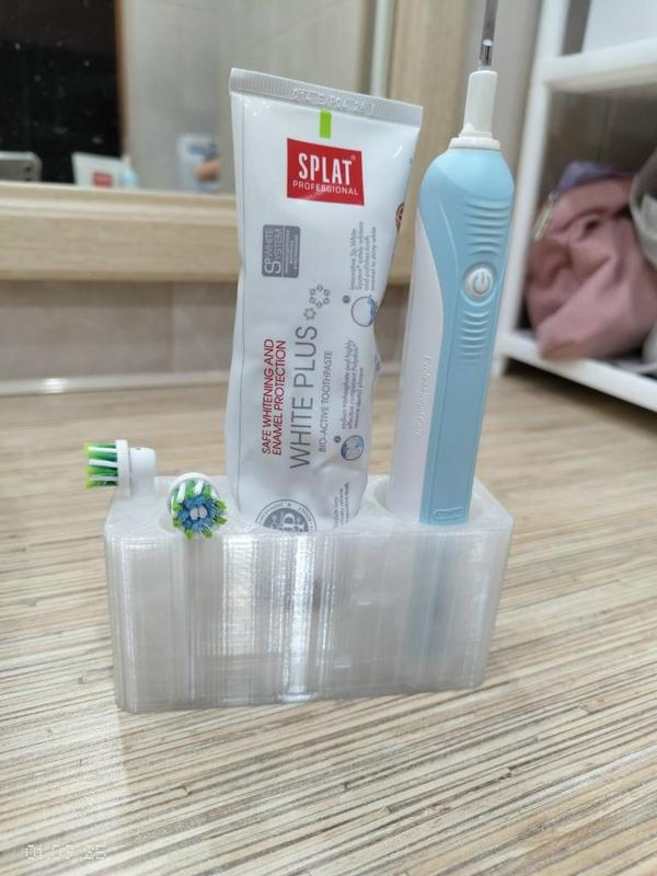 Electric toothbrush + nozzles + toothpaste holder