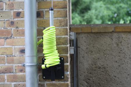 Hose holder for spiral hoses