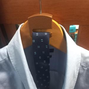 Tie peg for coat hanger