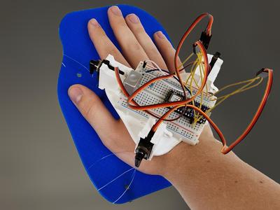 Servo & Arduino-Based Palm Squeezer for Feeling Surfaces in VR