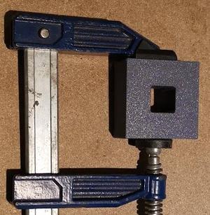 Clamping block for de-twisting 20x20 titanium tube gantry