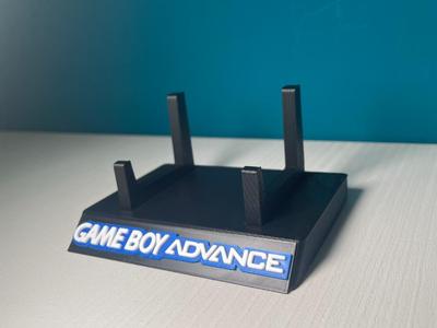NO AMS - Stand Game Boy Advance multicolore