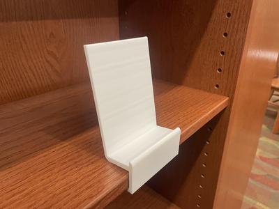 Shelf pinching book stand