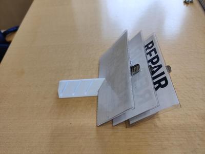 Tilted name badge storage/organizer